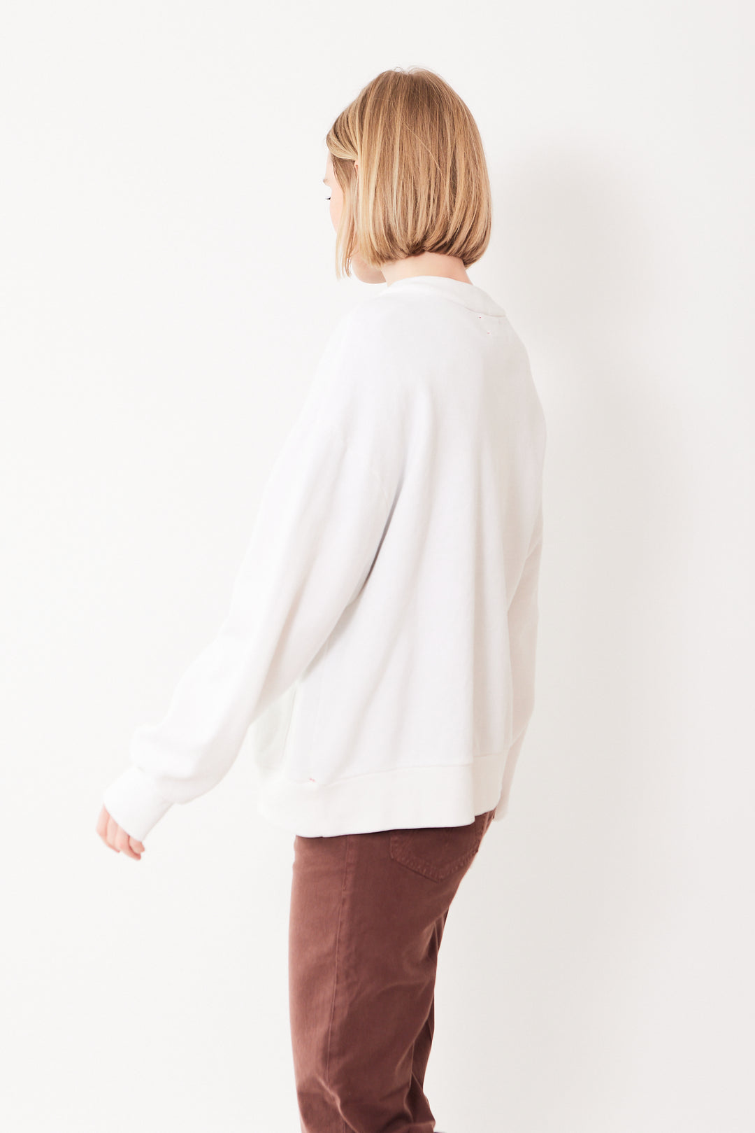 Madi wearing Xirena Benny Cardigan rear view