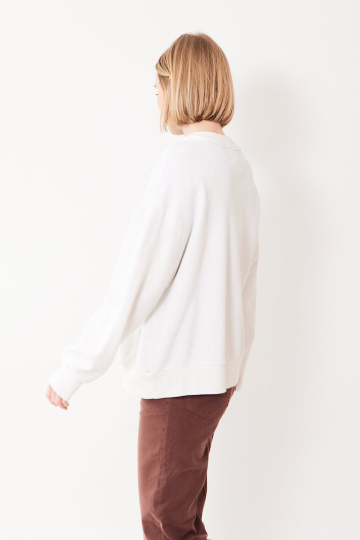 Madi wearing Xirena Benny Cardigan rear view