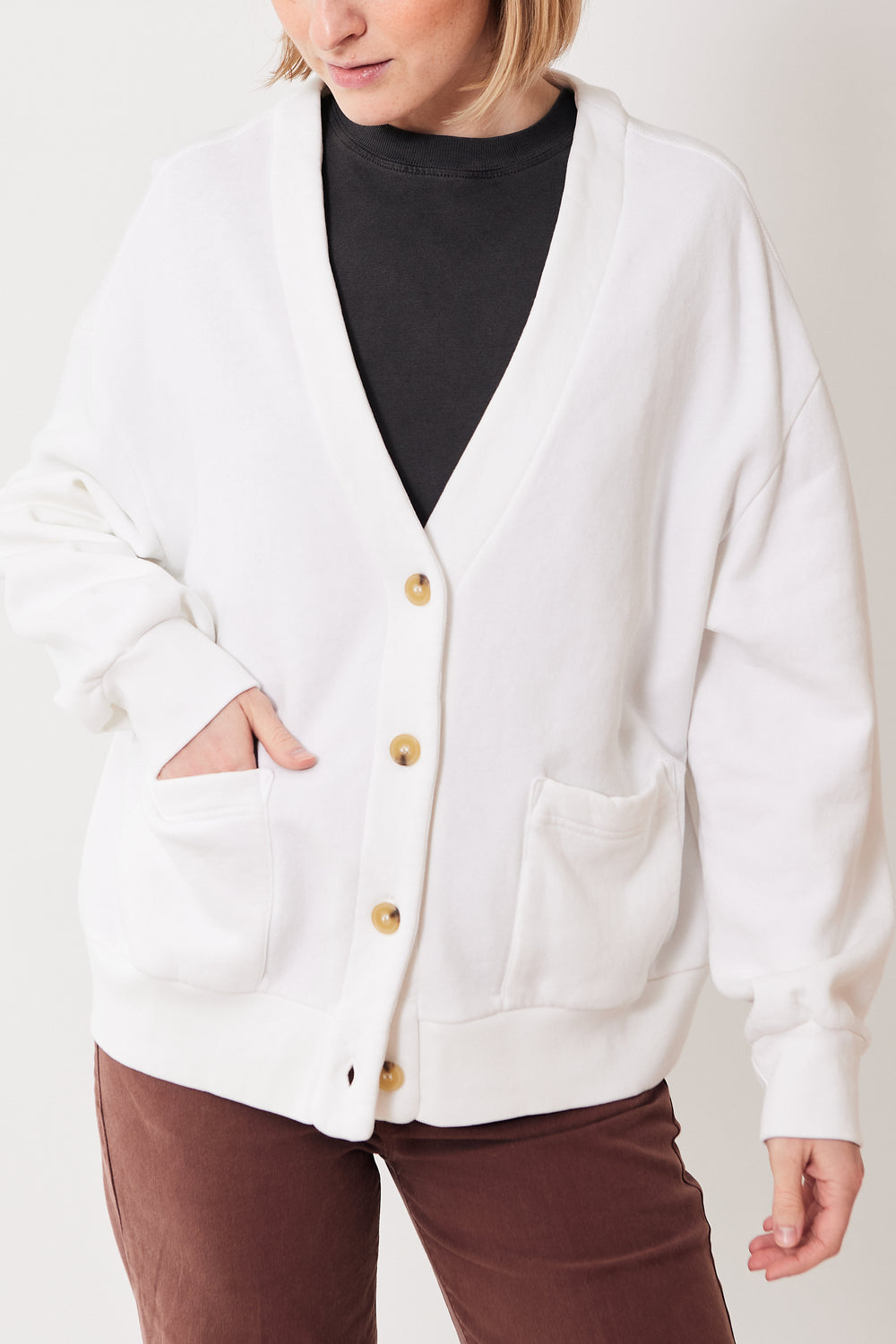 Madi wearing Xirena Benny Cardigan front view