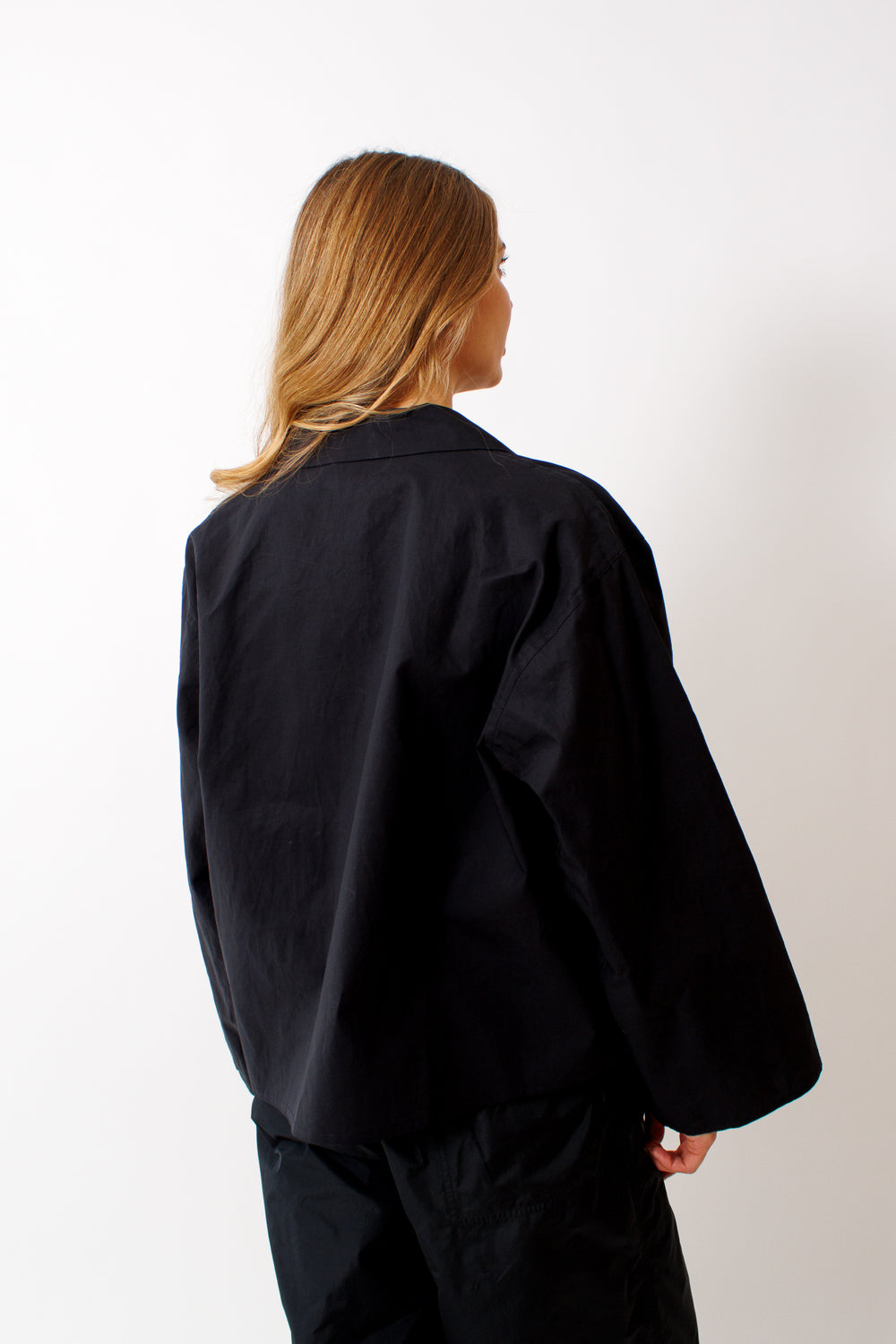 Mari wearing Sofie D'Hoore Cancun Bicolor Long Sleeve Jacket rear view