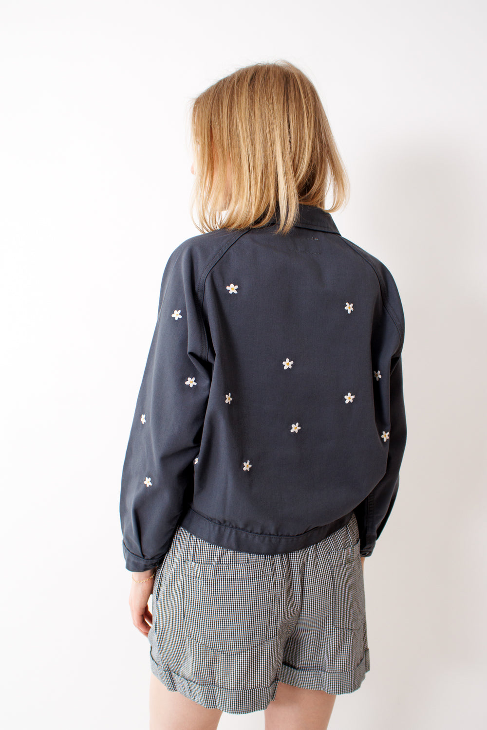 Madi wearing The Great The Garage Jacket With Daisy Embroidery rear view