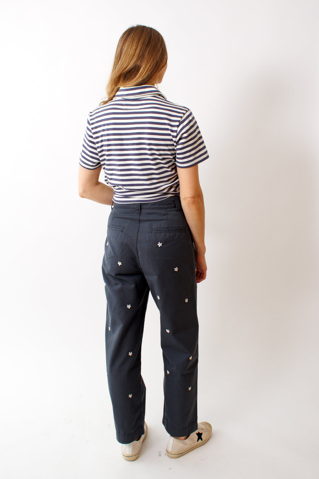 Mari wearing The Great The Garage Pant With Daisy Embroidery rear view