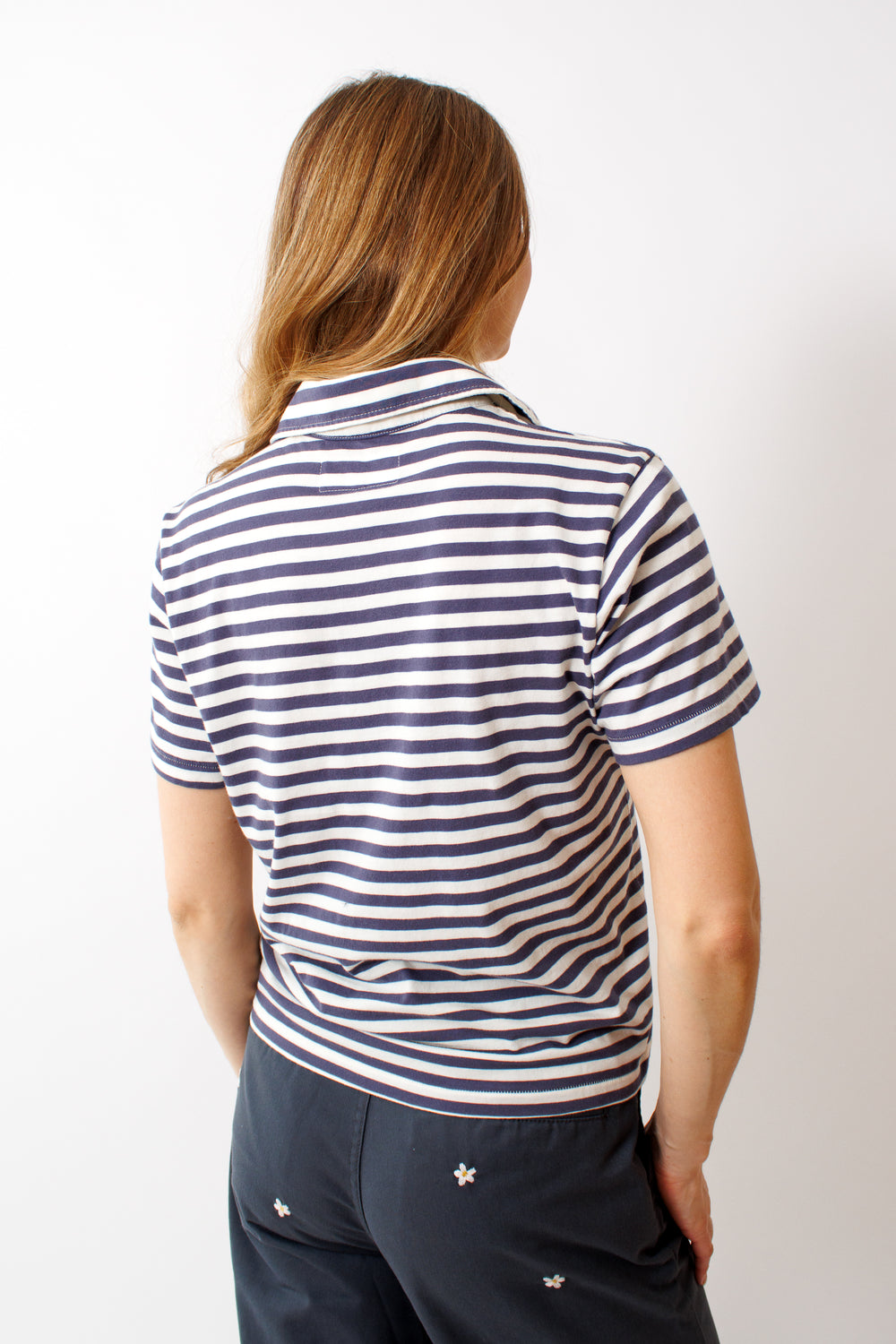 Mari wearing The Great The Lacrosse Polo rear view 