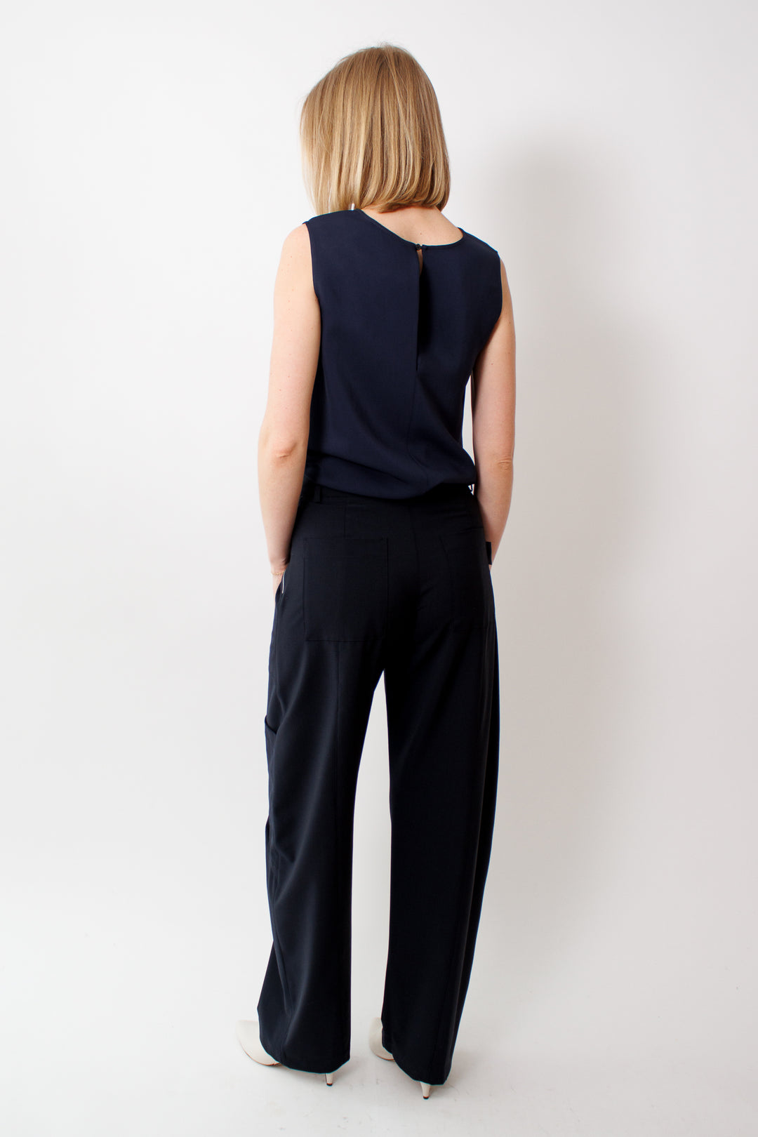 Madi wearing Seventy Bistretch Super 100 Fresh Wool Trousers rear view 