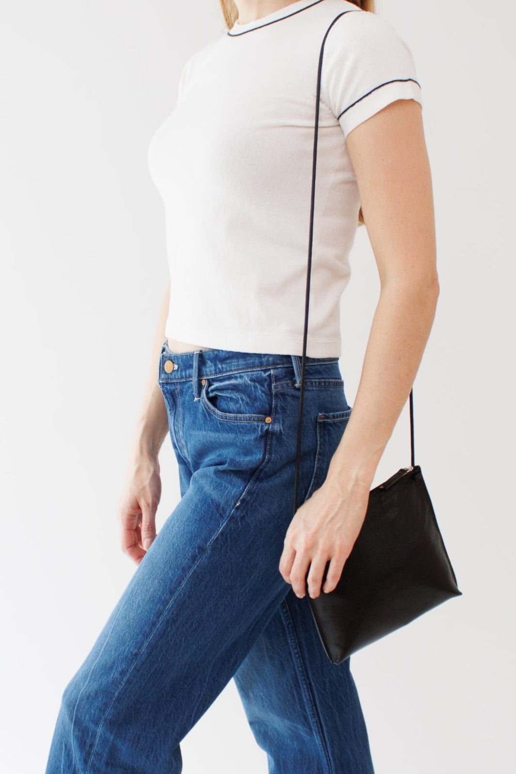 Mari wearing B. May Strappy Pouch front view