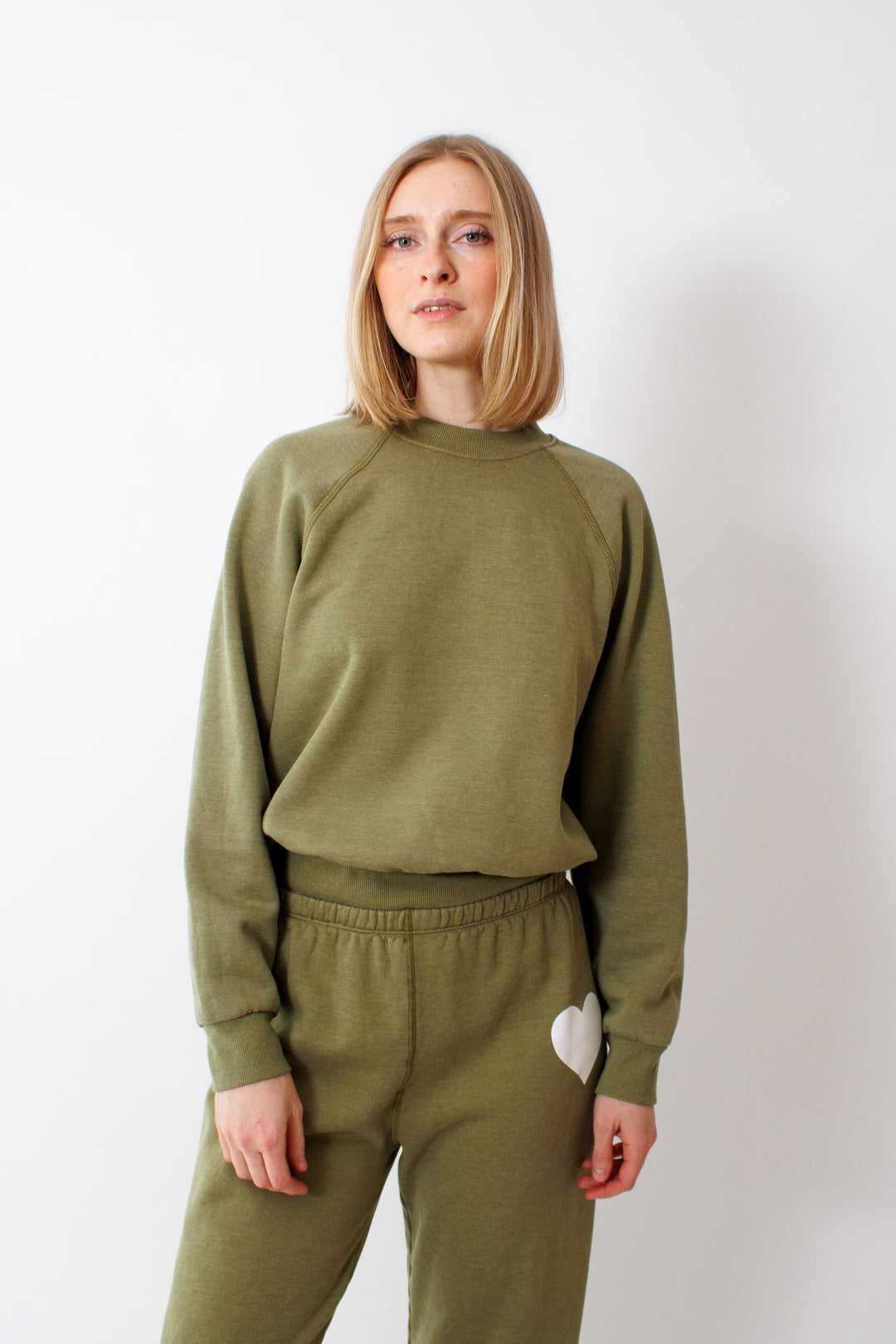Madi wearing SPRWMN Shrunken Raglan Sweatshirt front view 
