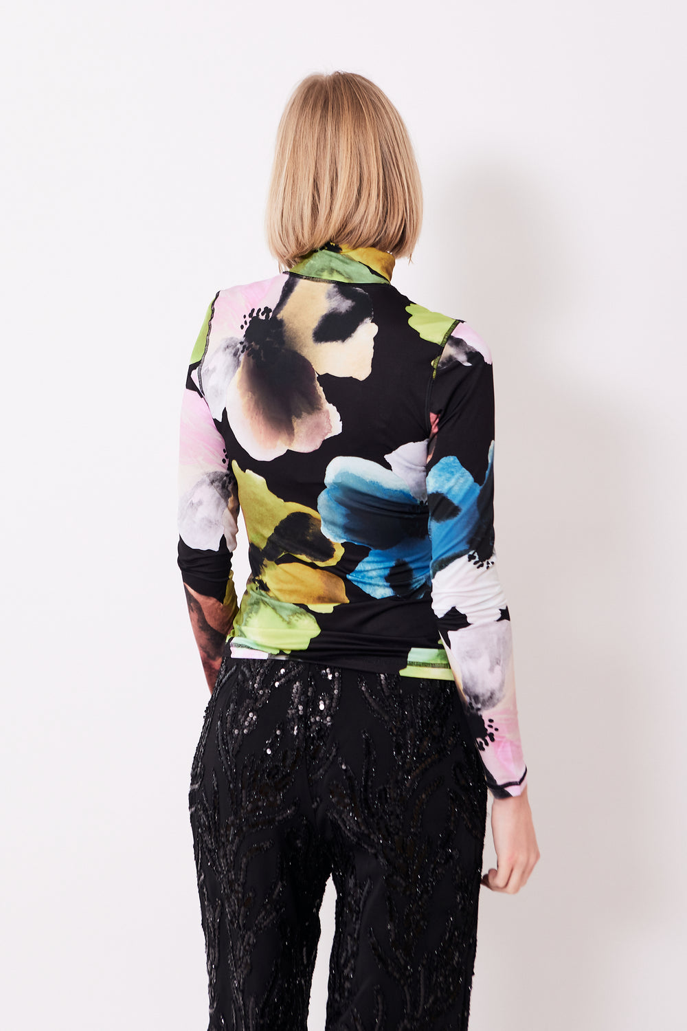 Madi wearing Stine Goya Elastic High Neck Collared Top rear view
