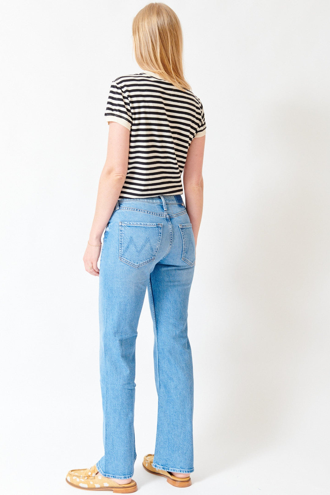 Madi wearing Mother Denim The Bookie Twist Skimp rear view