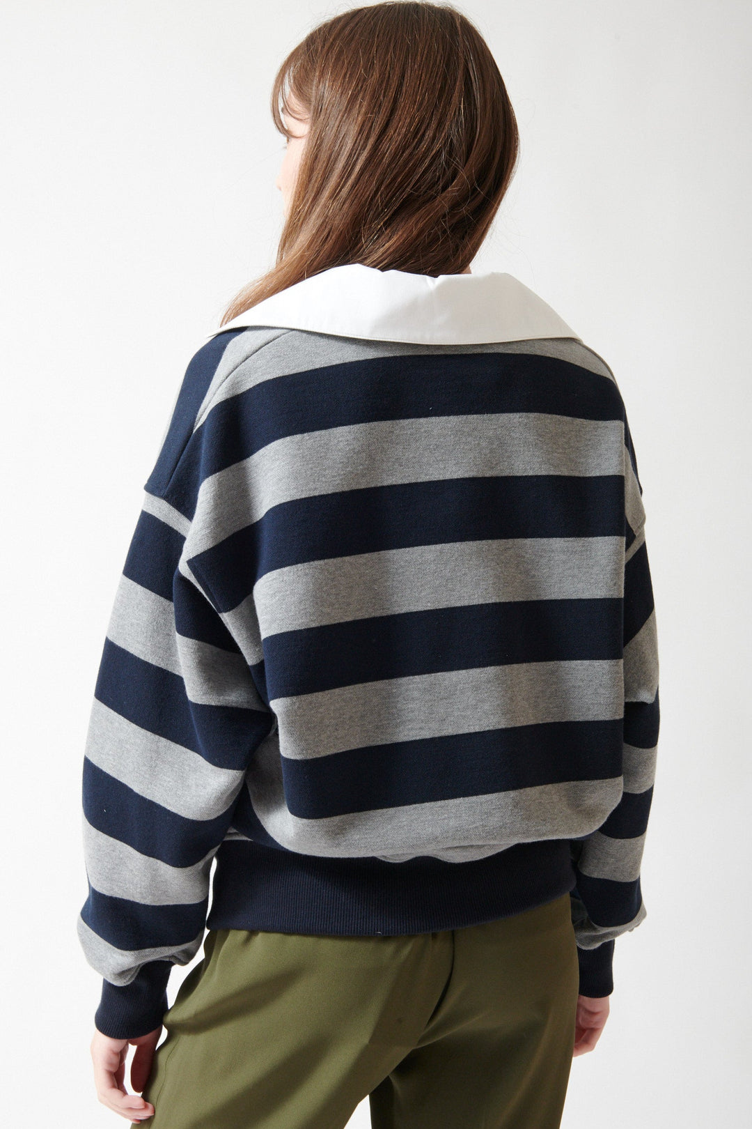 Angela wearing N°21 Dressed Up Oversized Polo Sweatshirt rear view