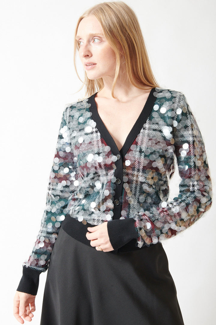 Madi wearing N°21 Stuck On You Paillettes Cardigan Party front view