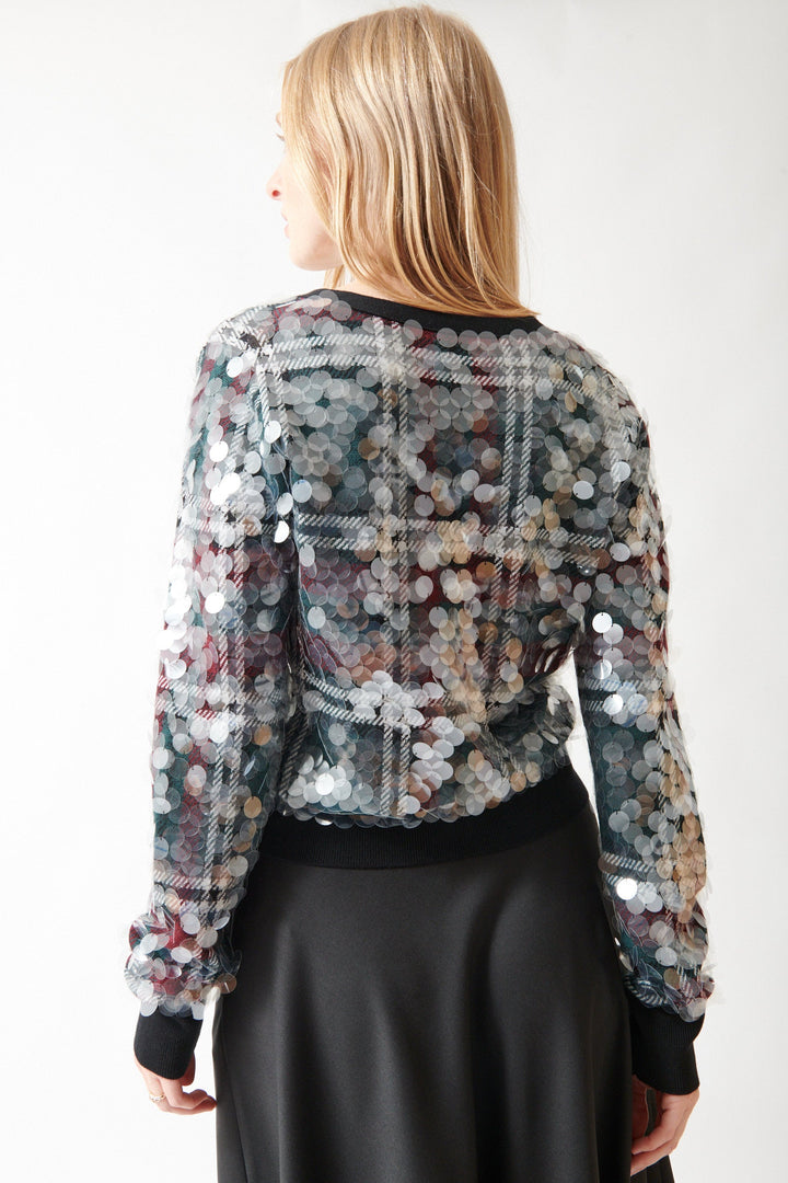 Madi wearing N°21 Stuck On You Paillettes Cardigan Party rear view