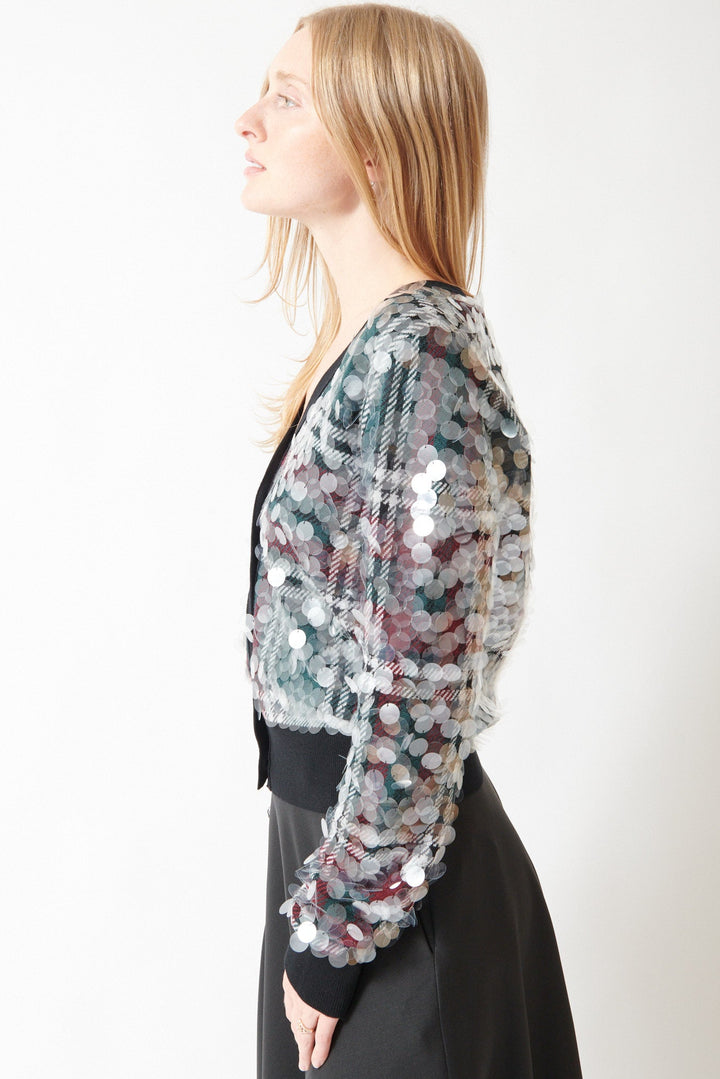 Madi wearing N°21 Stuck On You Paillettes Cardigan Party side view