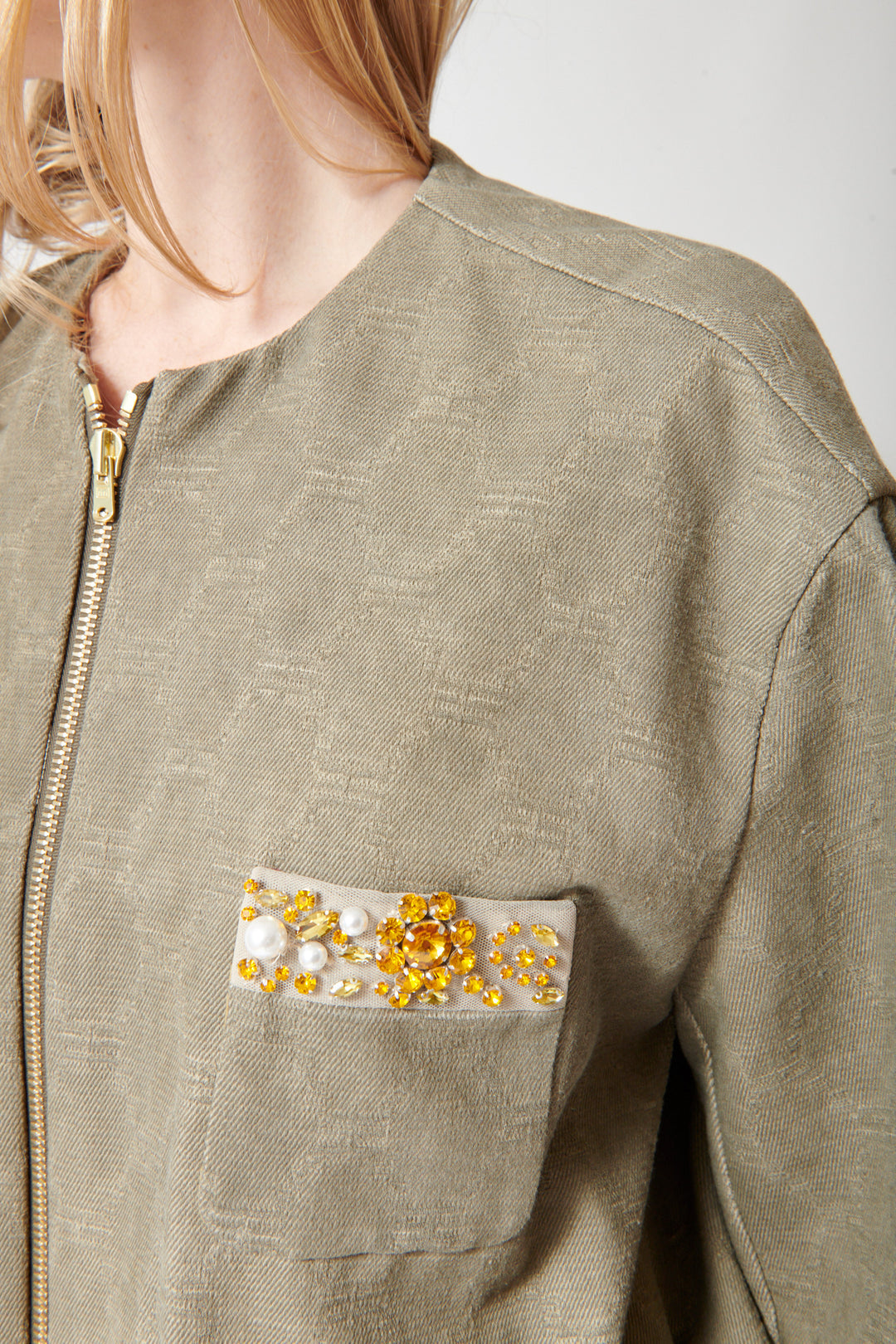 Madi wearing Odeeh Cotton Damask Bejeweled Zip Jacket front/pocket view