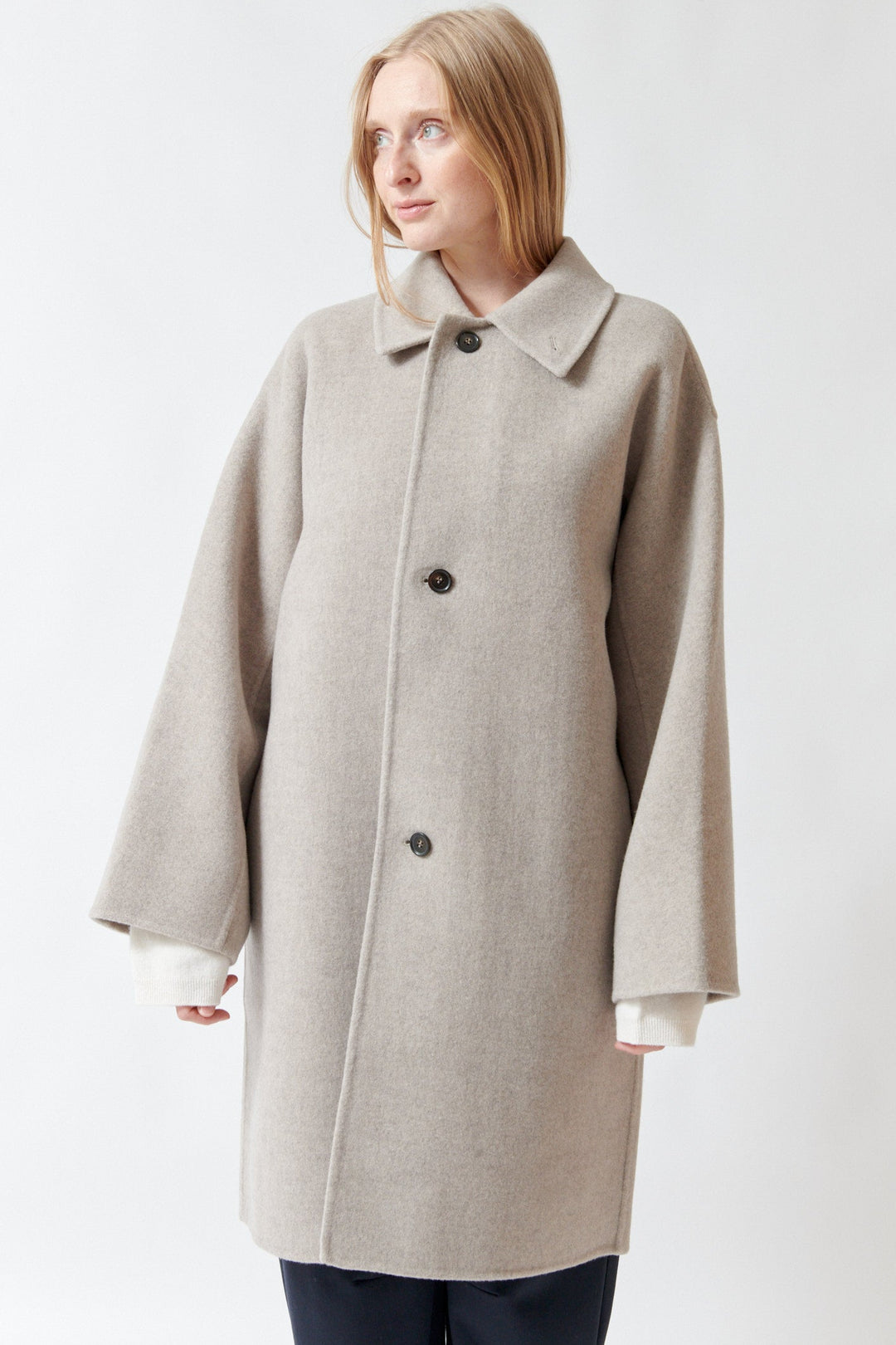 Madi wearing Sofie D'Hoore Carmine Long Jacket front view