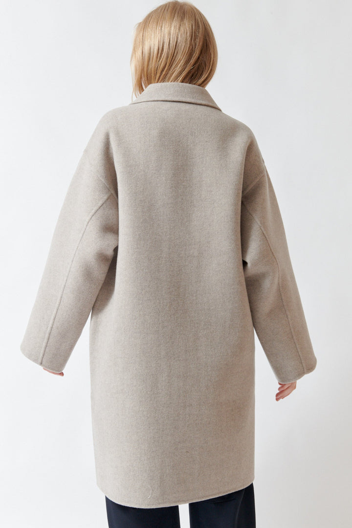 Madi wearing Sofie D'Hoore Carmine Long Jacket rear view