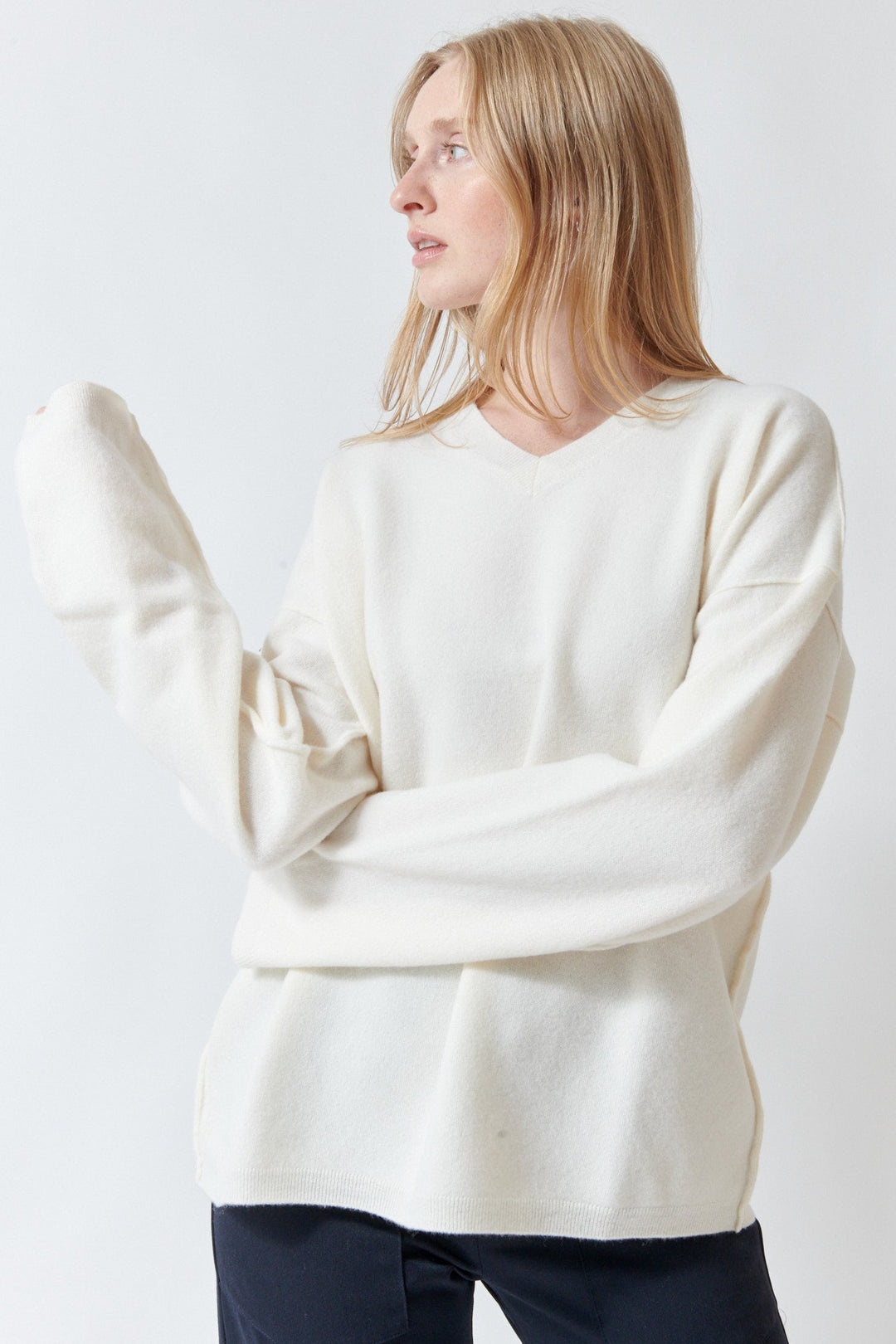 Madi wearing Sofie D'Hoore Maurice Long Sleeve V Neck Pullover front view