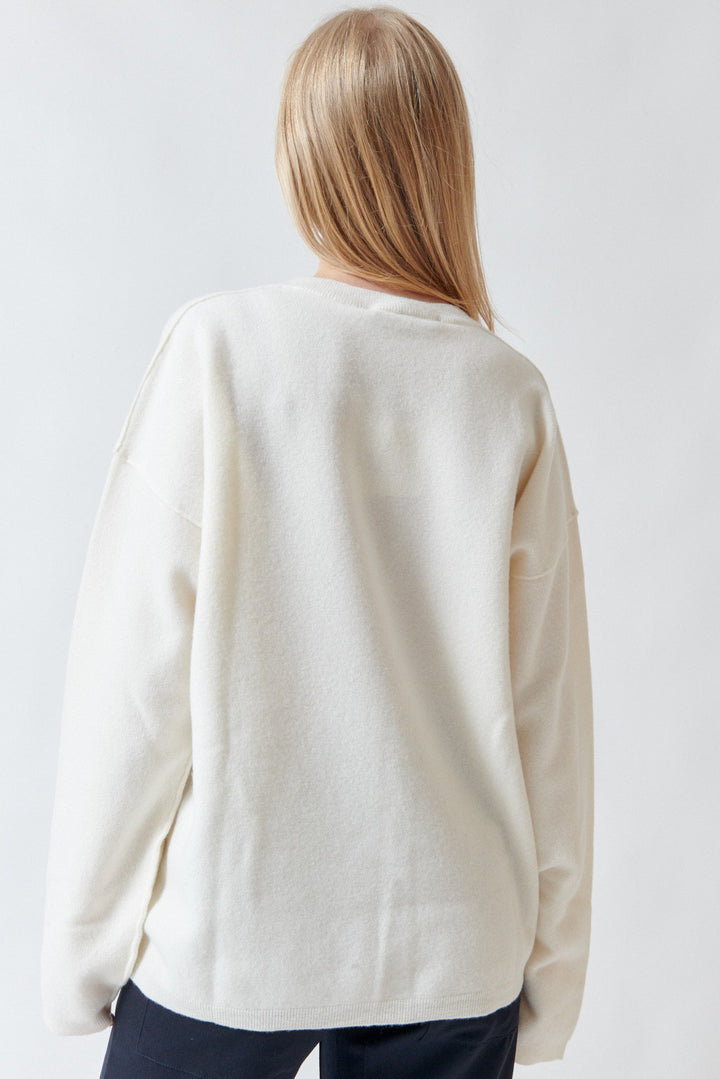 Madi wearing Sofie D'Hoore Maurice Long Sleeve V Neck Pullover rear view