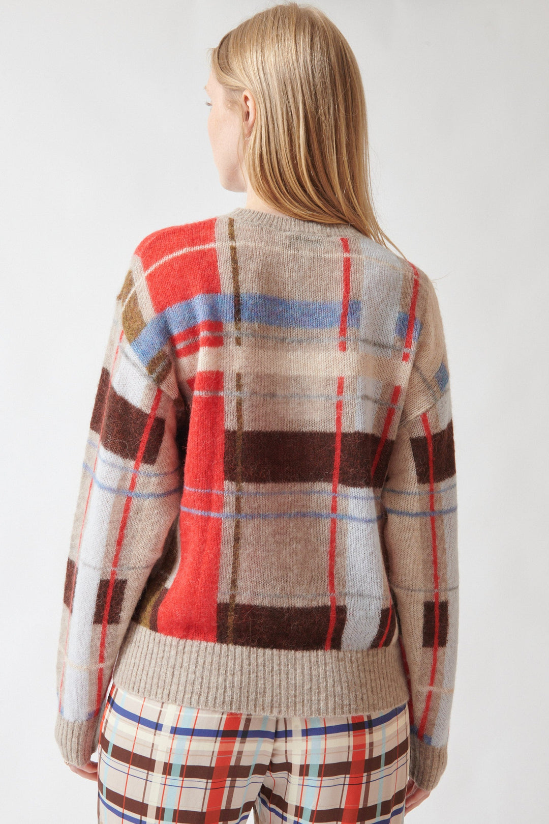 Madi wearing Stine Goya Wool Alpaca Long Sleeve Crewneck Knit Pullover Scarlet Grid rear view