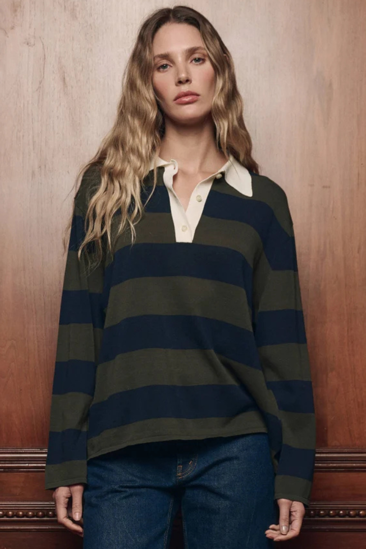 Model wearing The Great The Academy Polo Sweater Army League Stripe front view