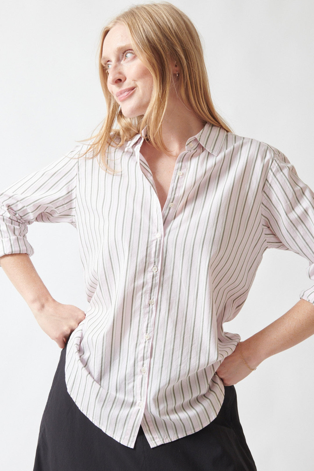 Madi wearing Xirena Beau Shirt in Matcha Pink Stripe front view
