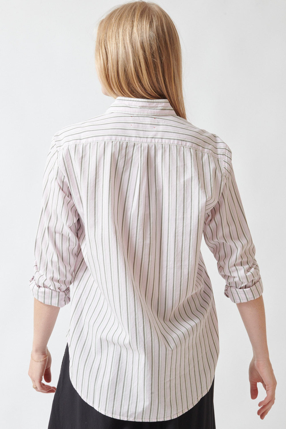 Madi wearing Xirena Beau Shirt in Matcha Pink Stripe rear view