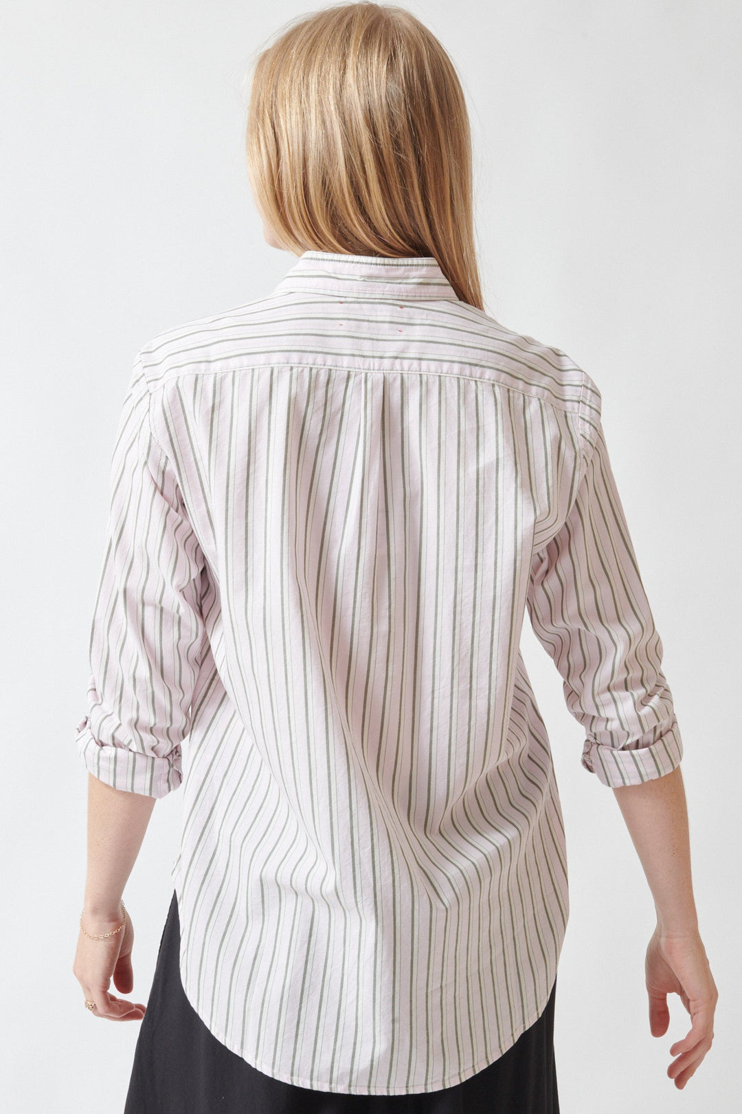 Madi wearing Xirena Beau Shirt in Matcha Pink Stripe rear view