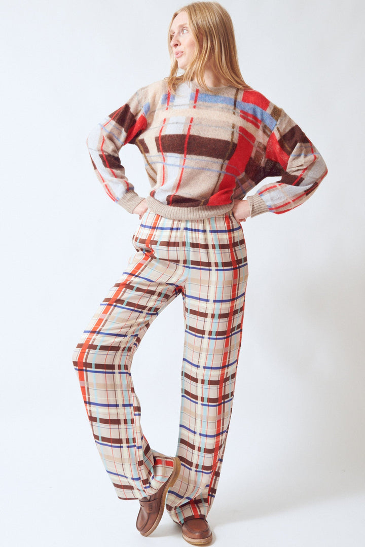 Madi wearing Stine Goya Dry Viscose Elasticated Long Pants Scarlet Grid front view