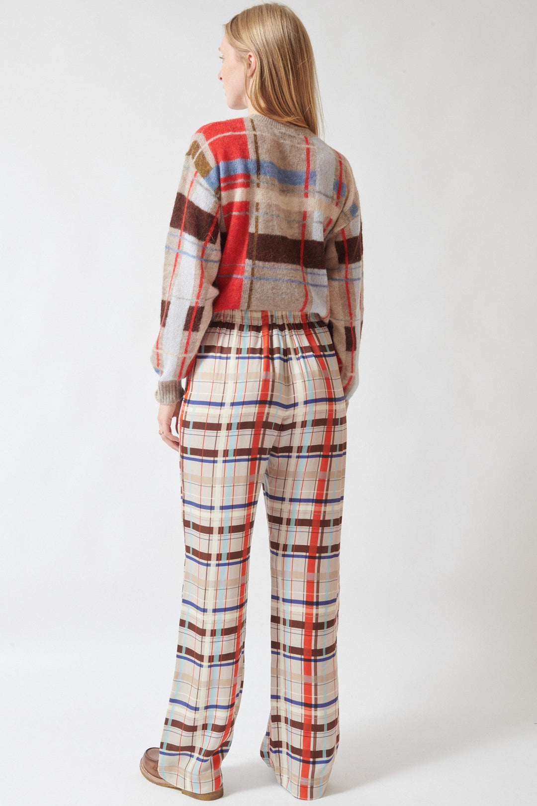 Madi wearing Stine Goya Dry Viscose Elasticated Long Pants Scarlet Grid rear view