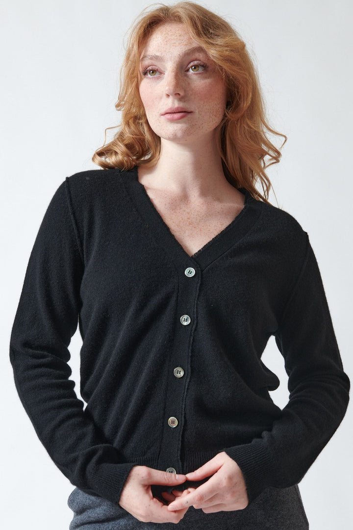 Waverly wearing Jumper 1234 Cashmere Distressed Vee Cardigan front view
