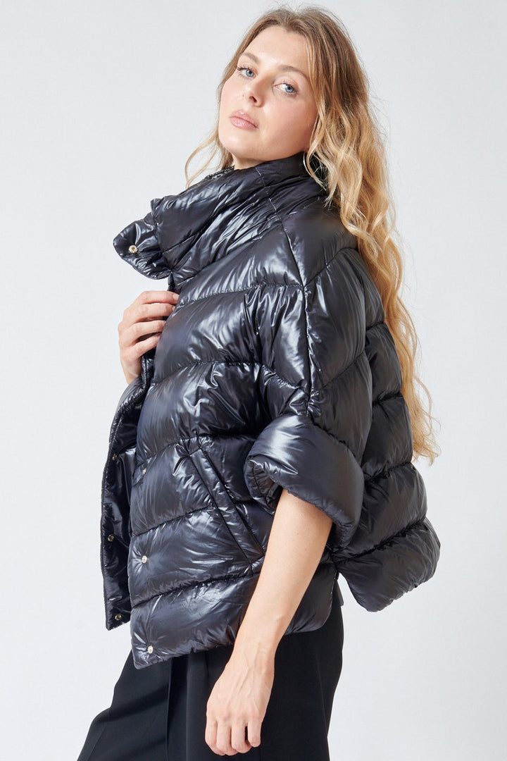 Mari wearing Herno Mid Sleeve Puffer Jacket With Added Arm Warmer Sleeve Black side view