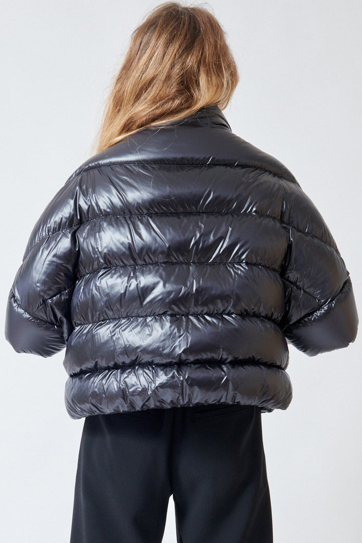 Mari wearing Herno Mid Sleeve Puffer Jacket With Added Arm Warmer Sleeve Black rear view