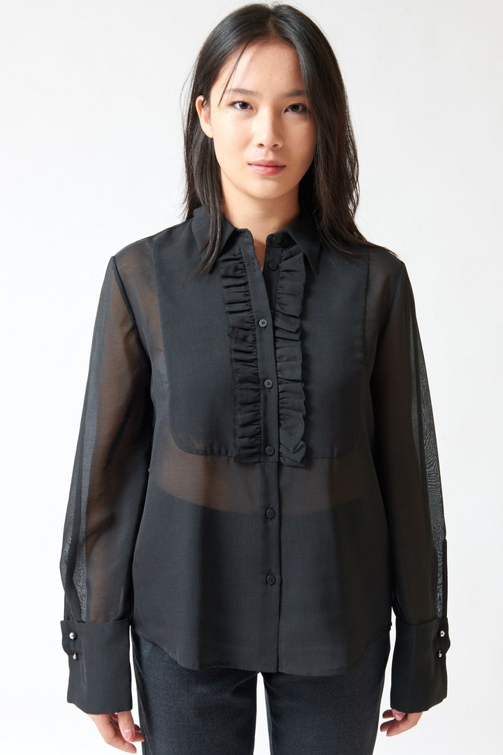 Lilly wearing Tela Opal Shirt front view