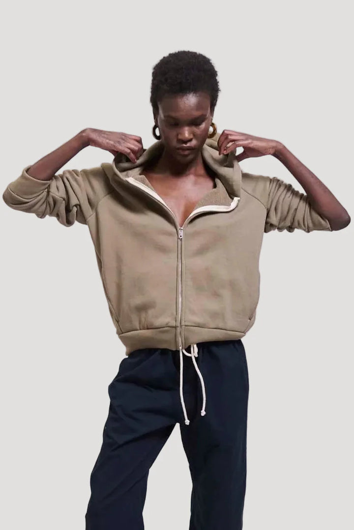 Model wearing Jamie Haller The Bird Hoodie in Loden front view