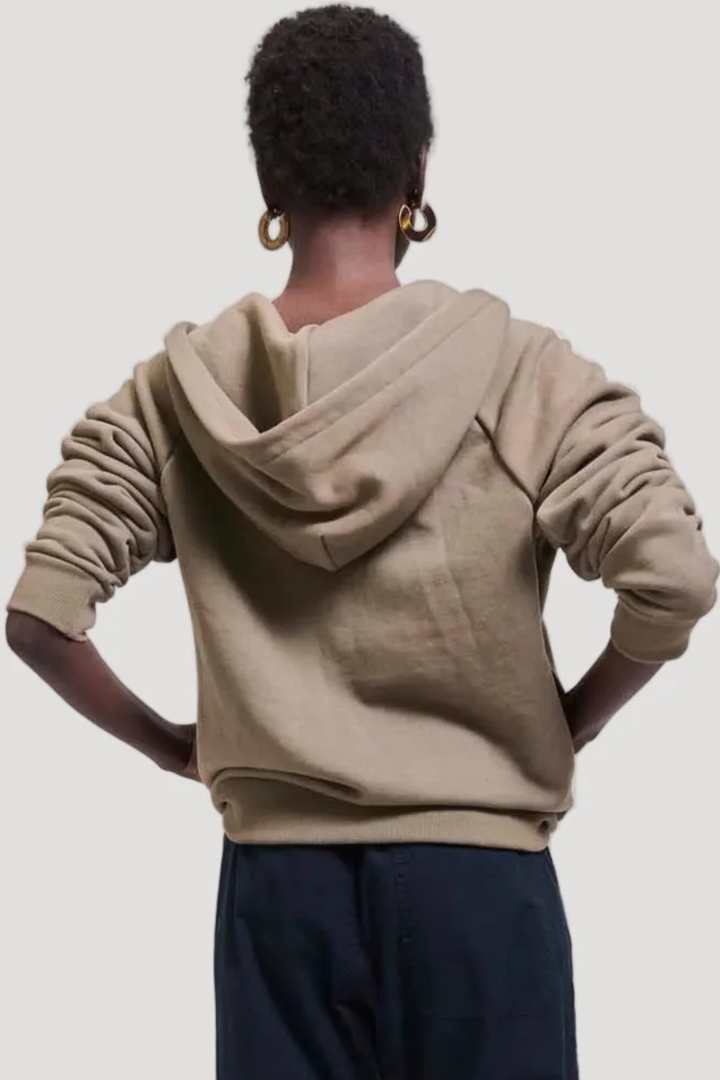 Model wearing Jamie Haller The Bird Hoodie in Loden rear view