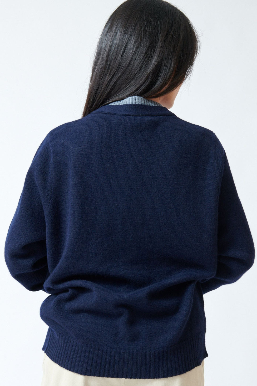 Lilly wearing Tela Fei Cardigan rear view