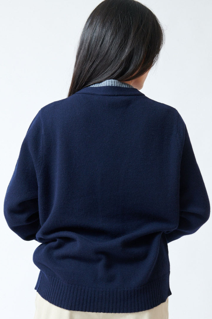 Lilly wearing Tela Fei Cardigan rear view