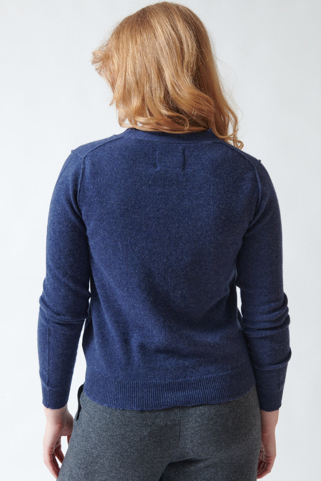 Model wearing Jumper 1234 Cashmere Distressed Vee Cardigan rear view