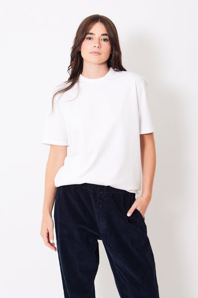 Front view of model wearing basic white tee shirt