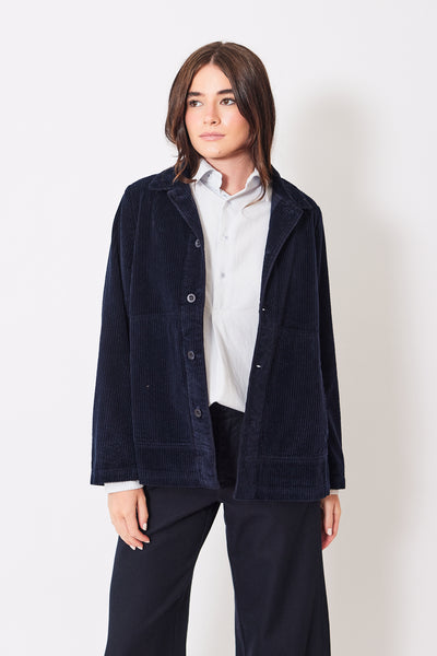 Front view of model wearing navy blue corduroy jacket