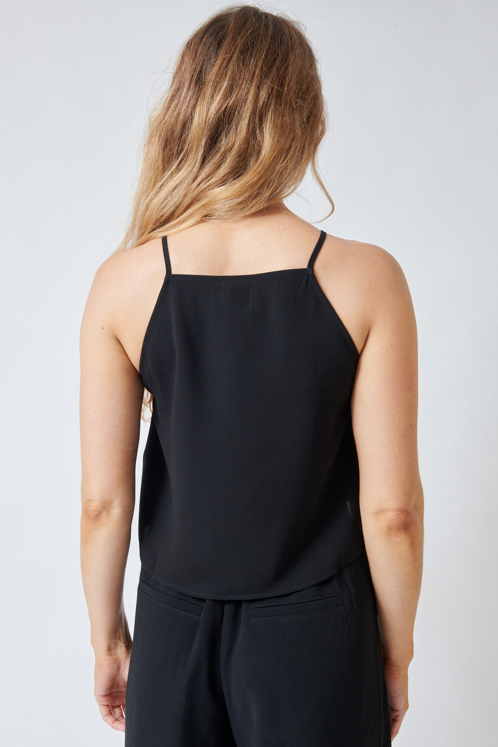 Mari wearing LESET Ari High Neck Tank Black rear view