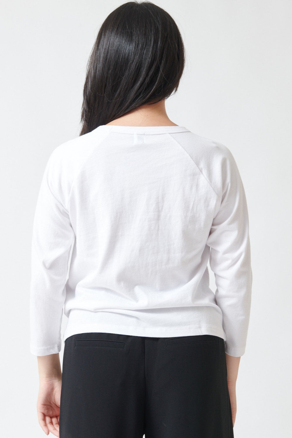 Lilly wearing LESET Margo Baseball Tee White rear view
