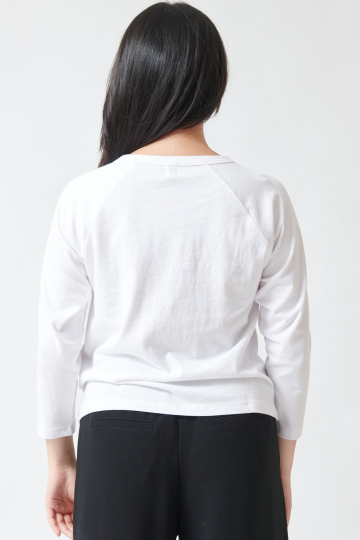 Lilly wearing LESET Margo Baseball Tee White rear view