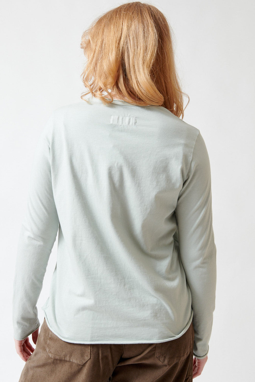 Waverly wearing Labo.Art Agapi Long Sleeve Tee rear view