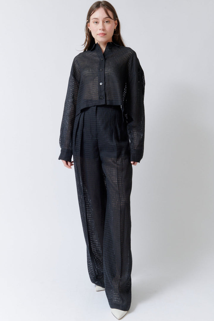 Angela wearing Mantu Lanisha Pleated Trousers front view
