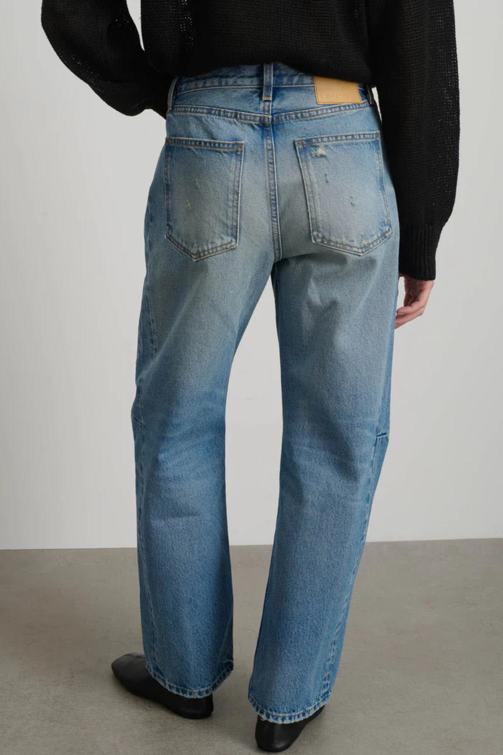 Model wearing B SIDES Slim Lasso rear view