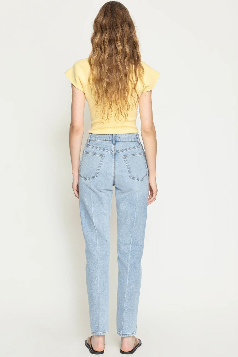 Model wearing OSSOU Noon Jean Salt W Crease rear view