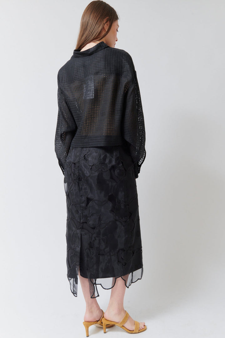 Angela wearing Meimeij Floral Cut Out Overlay Skirt Black rear view