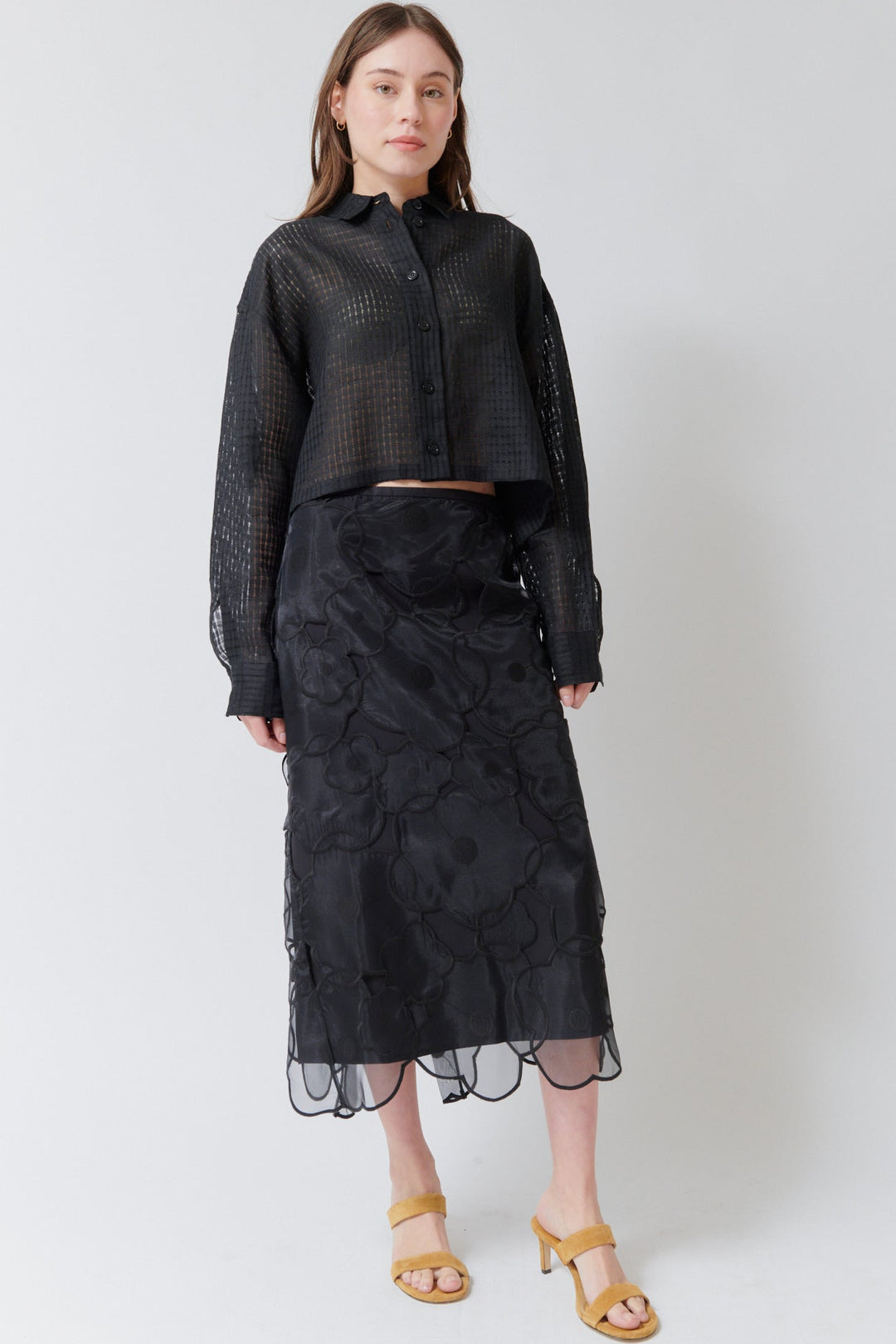 Angela wearing Meimeij Floral Cut Out Overlay Skirt Black front view