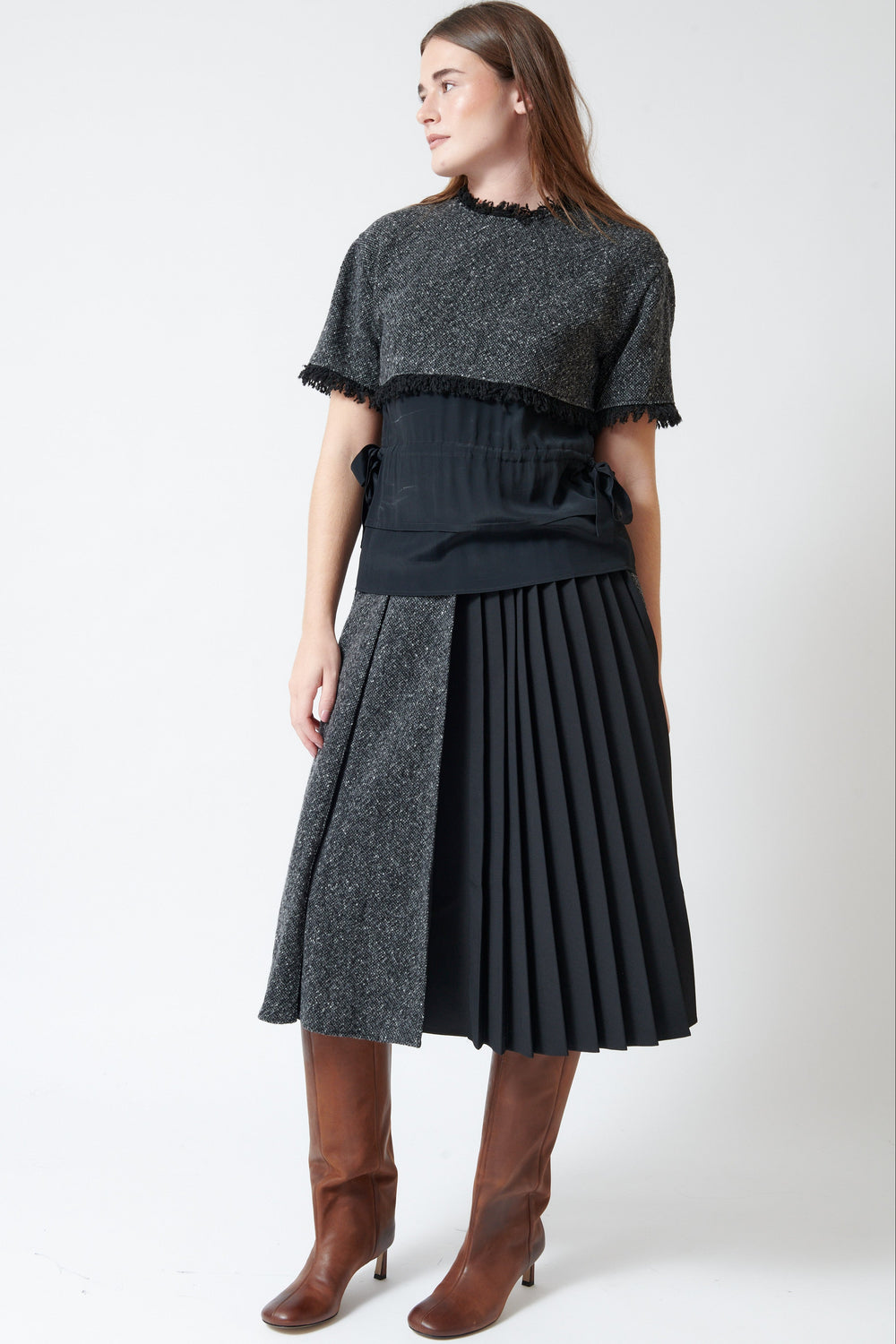 Model wearing Mantu Compact Tweed Wide Pleat Skirt front view