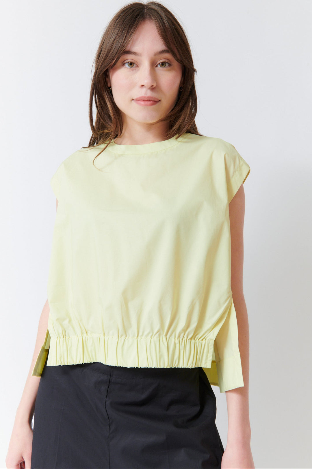 Angela wearing Meimeij Side Split Sleeveless Top front view